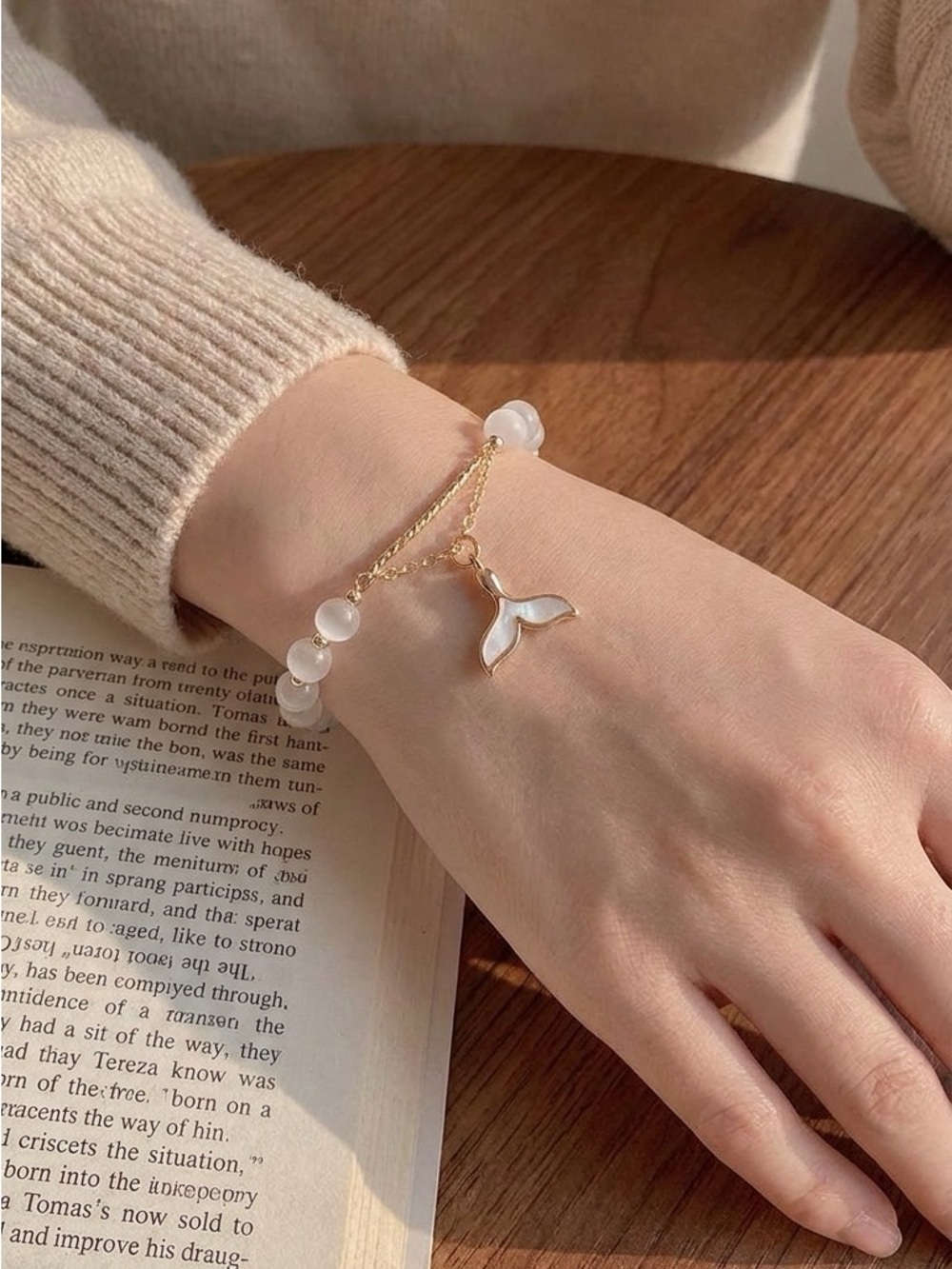 Anthropologie Gold Bracelet with White Beads and Mermaid Tail Charm